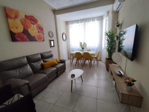 a living room with a couch and a table at ★★APARTAMENTOS MARIN★★ in Alicante