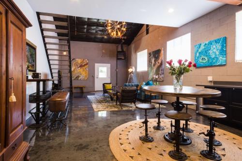 a room with tables and stools in a restaurant at Petaluma Warehouse Lofts unit E in Petaluma