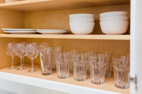 a bunch of glasses sitting on a shelf at Petaluma Warehouse Lofts unit E in Petaluma