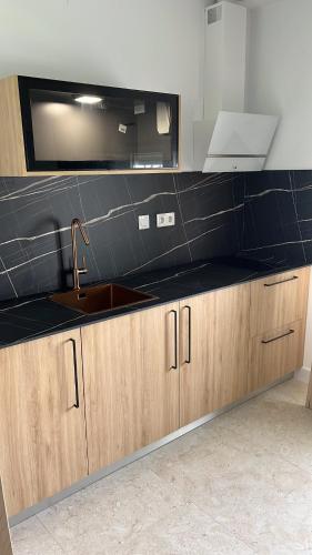 a kitchen with a sink and a counter top at Villa Don Paco in Las Negras