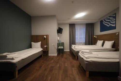 Letto o letti in una camera di Stay Vilnius Hotel