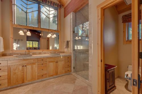 a bathroom with two sinks and a shower at Sundance Lodge -Mountain Home w Views of Palisades - Ski Shuttle, Pets okay! in Olympic Valley