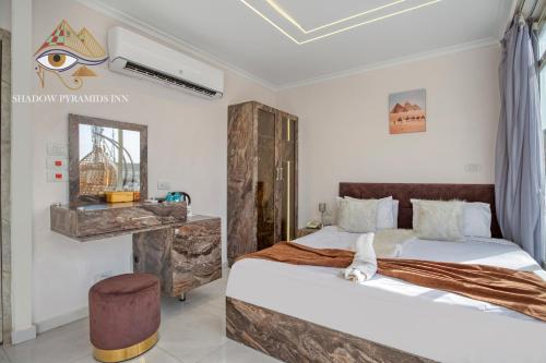 a bedroom with two beds in a room at Shadow Pyramids Suites and Jacuzzi in Cairo
