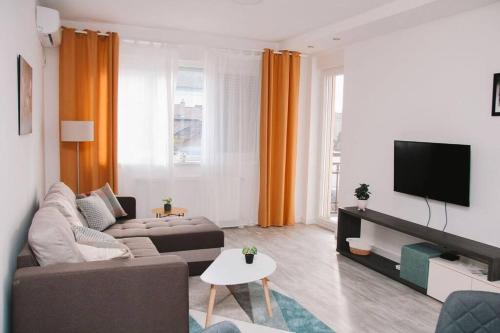 TV i/ili multimedijalni sistem u objektu White apartment