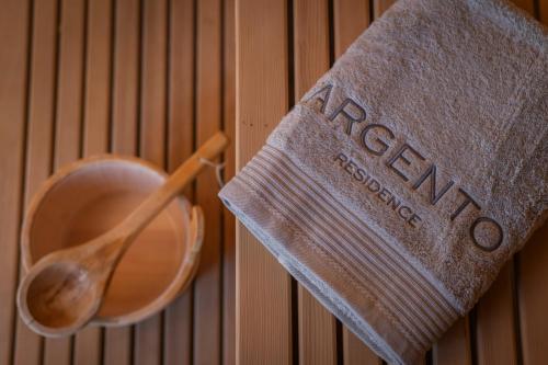 a wooden spoon and a towel on a wall at ARGENTO RESIDENCE in Zagvozd