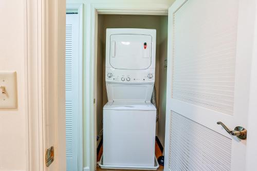 a white washer and dryer in a room at Spacious Condo with View Less Than 1 Mi to Mtn Creek Resort! in Vernon Township