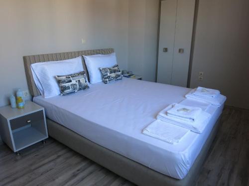 Кровать или кровати в номере Pantheon Aparthotel