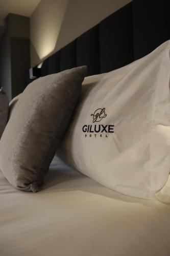 Un ou plusieurs lits dans un hébergement de l'établissement Giluxe Hotel