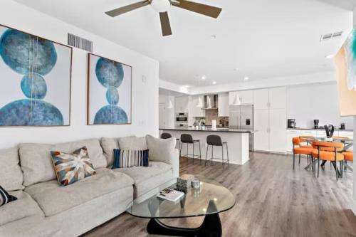 a living room with a couch and a table at Ruby Tide - Two Floor Airy 2BR Marina Side Exclusive Amenities in Los Angeles