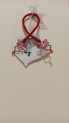 a red ribbon is hanging on a wall at Lusitana Alloggi in Foligno