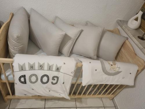 a pile of white pillows on a shelf at Moderne Landwohnung - Pension - Top Lage in Gottmadingen