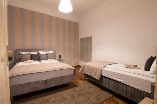 Кровать или кровати в номере Sweet House Republic