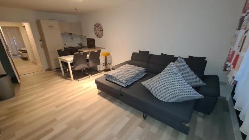 a living room with a couch and a table at Apartament Berghof in Bayerischen Wald in Sankt Englmar