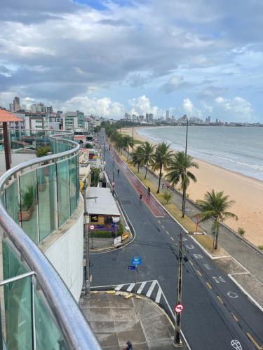 a view of a street with a beach and the ocean at APART HOTEL MANAÍRA PALACE in João Pessoa