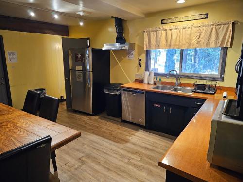 a kitchen with a sink and a counter top at Moderne Hostel in Mammoth Lakes