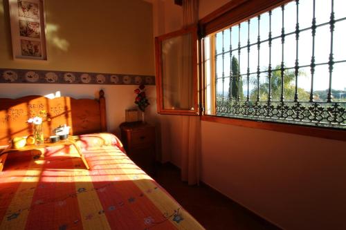 Säng eller sängar i ett rum på El paraíso tropical en Málaga