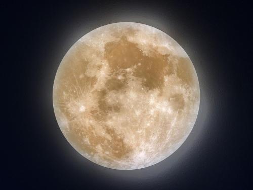 a close up of a yellow moon in the sky at Sleephotels Cosmos in Hamburg