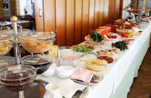 a buffet with many different types of food on a table at Hotel Schilcherlandhof in Stainz