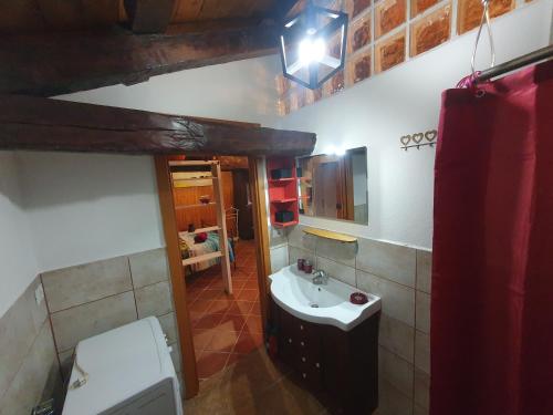 a bathroom with a sink and a toilet at Casa Puggimiano in Poggio Moiano