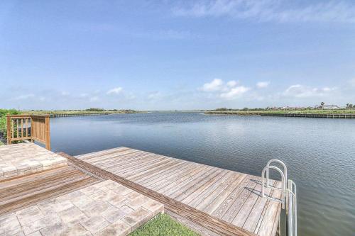 a view of a lake with two wooden docks at Nauti Captain in Port Aransas