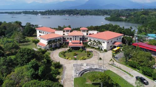 an aerial view of a building with a lake at Hotel Palacio Puerto Princesa in Puerto Princesa City