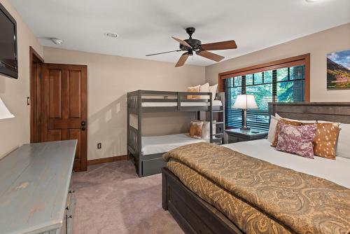 a bedroom with a bunk bed and a ceiling fan at Fasching Haus 250, Cozy and Convenient 1 Bedroom, 2 Blocks from Aspen in Aspen