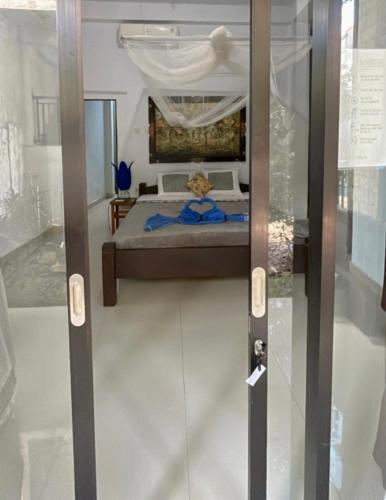 a door to a room with a bed in a museum at D Jana in Amed