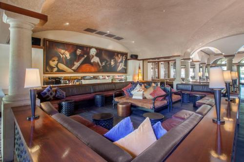 a living room with couches and a painting on the wall at Omni Scottsdale Resort & Spa at Montelucia in Scottsdale