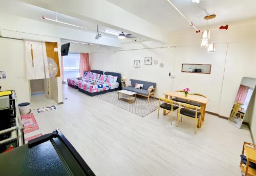 a living room with a couch and a table at Sunway Geo Avenue / Sunway Medical Centre / Pyramid / Lagoon in Petaling Jaya