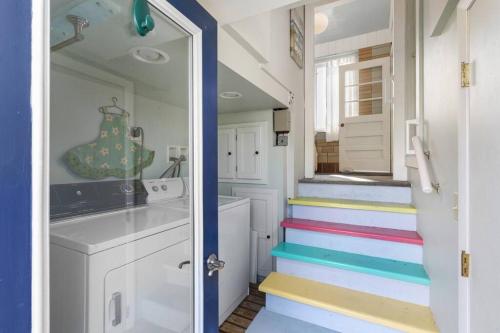 a stairway with colorful steps in a tiny house at Salt Pond Sunrise View & 5 min to beach, sleeps 7 in Charlestown