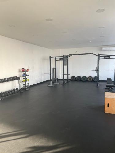 a gym with two racks of weights at Studio Panama in Panama City