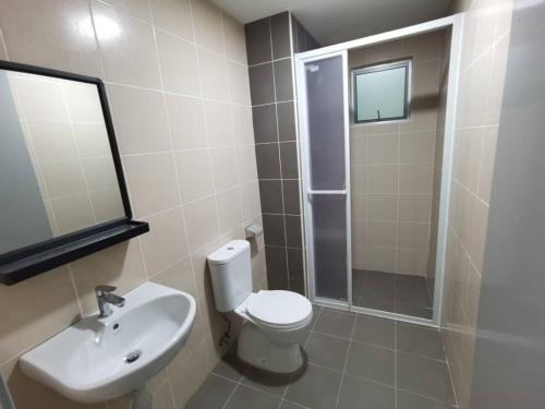 a bathroom with a toilet and a sink and a shower at RC Firdaus Homestay Kuala Lumpur in Kuala Lumpur