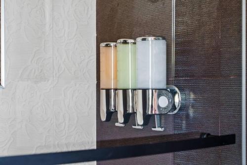 a group of kitchen utensils hanging on a wall at Gamers Getaway: Arcade, Theater, Racing, And More! in Stanton