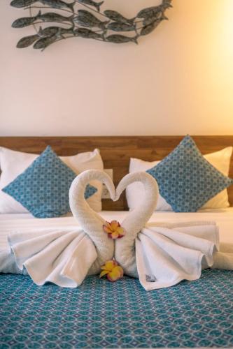 Ένα ή περισσότερα κρεβάτια σε δωμάτιο στο The Calna Villa Bali