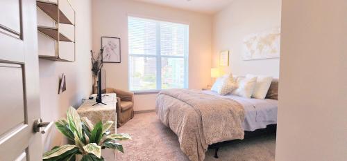 a bedroom with a bed and a window at Adorable 5star Luxury Living in Houston