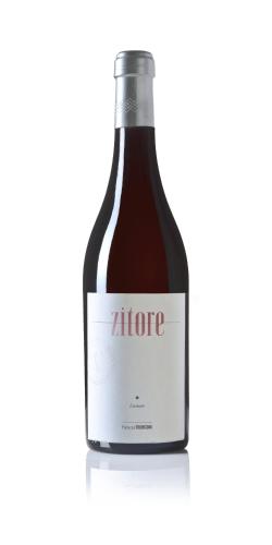 a bottle of alpha wine against a white background at Palazzo Tronconi agriturismo in Arce