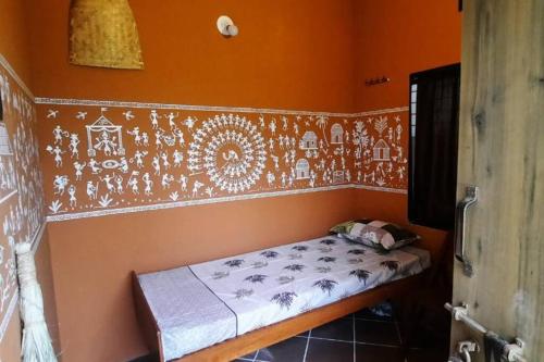 Postel nebo postele na pokoji v ubytování Gautami Villa
