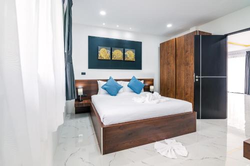 Ένα ή περισσότερα κρεβάτια σε δωμάτιο στο Mango Hill Residence