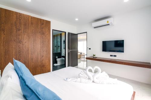 Ένα ή περισσότερα κρεβάτια σε δωμάτιο στο Mango Hill Residence