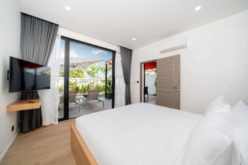 Ένα ή περισσότερα κρεβάτια σε δωμάτιο στο Mango Hill Residence