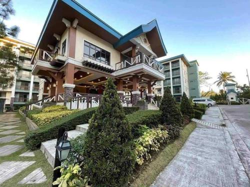 a large building with a balcony in front of it at 2BR Tagaytay Affordable staycation in Tagaytay
