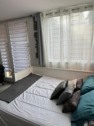 Cama ou camas em um quarto em Le Gîte au cœur de la Provence