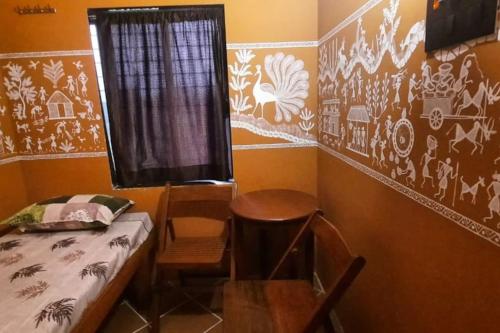 Postel nebo postele na pokoji v ubytování Gautami Villa