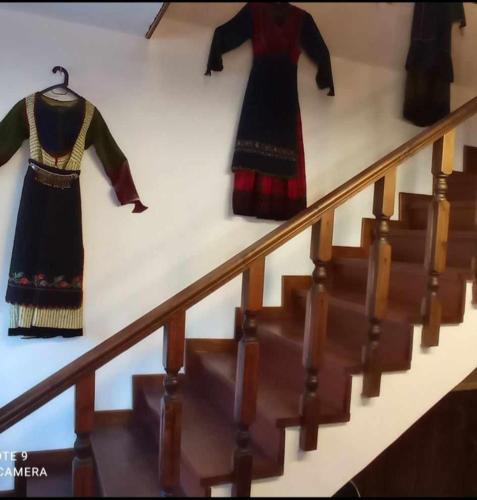 two dresses on display on the stairs in a museum at ΟΡΕΙΝΟ ΟΝΕΙΡΟ in Anilio