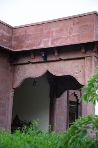 an entry to a building with a window at Kot Dunara - A 16th Century Castle near Jodhpur in Jodhpur
