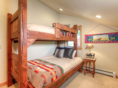 a bedroom with two bunk beds in a house at Black Eagle 10 in Big Sky