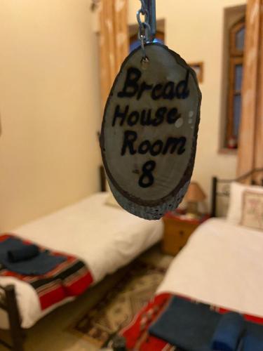 a sign that says bread house room and two beds at BREAD HOUSE in Bethlehem