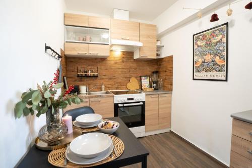a kitchen with a table with plates on it at Pretty Jolie Romantic Getaway in Bled