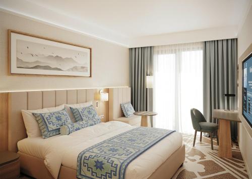 Llit o llits en una habitació de LIVINGSTON GRAND RESORT & SPA