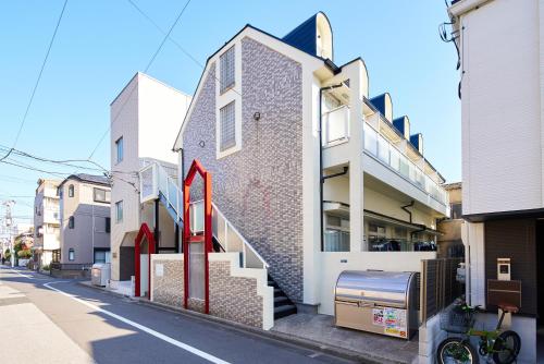 a building with a red arrow on the side of it at SC101 - Tokyo Stay Easy Access to Asakusa & Skytree in Tokyo